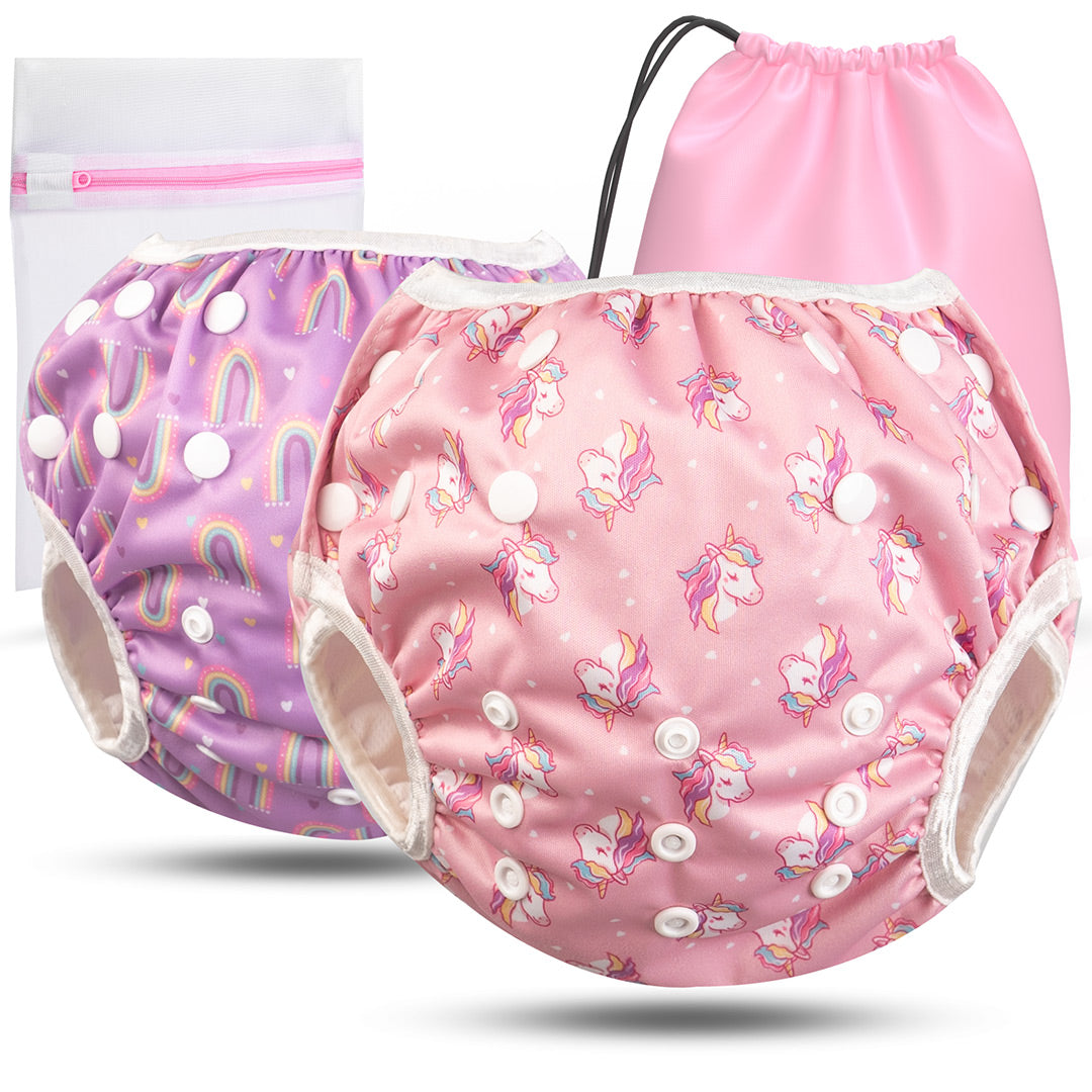 2er Set wiederverwendbare Baby Schwimmwindeln mit Druckknöpfen von 0-3 Jahre in Lila mit Regenbogen Muster und in pink mit Einhorn Muster