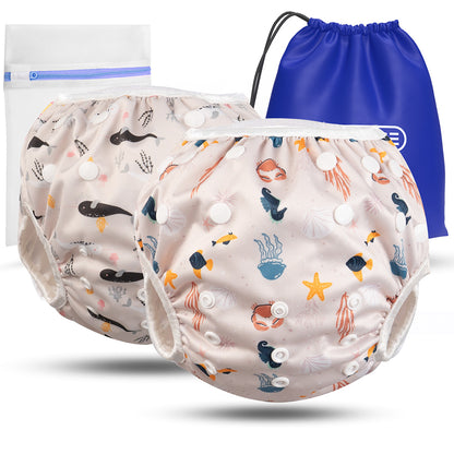 2er Set wiederverwendbare Baby Schwimmwindeln mit Druckknöpfen von 0-3 Jahre in beige mit Wal Muster und in beige mit Meerestier Muster