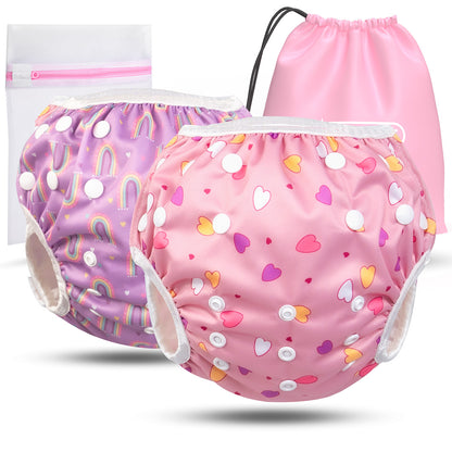2er Set wiederverwendbare Baby Schwimmwindeln mit Druckknöpfen von 0-3 Jahre in Lila mit Regenbogen Muster und in rosa mit Herz Muster